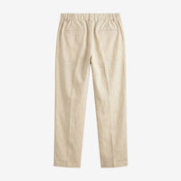 A pair of beige trousers shown from the back, featuring an elastic waistband and two welt pockets, set against a plain light gray background.