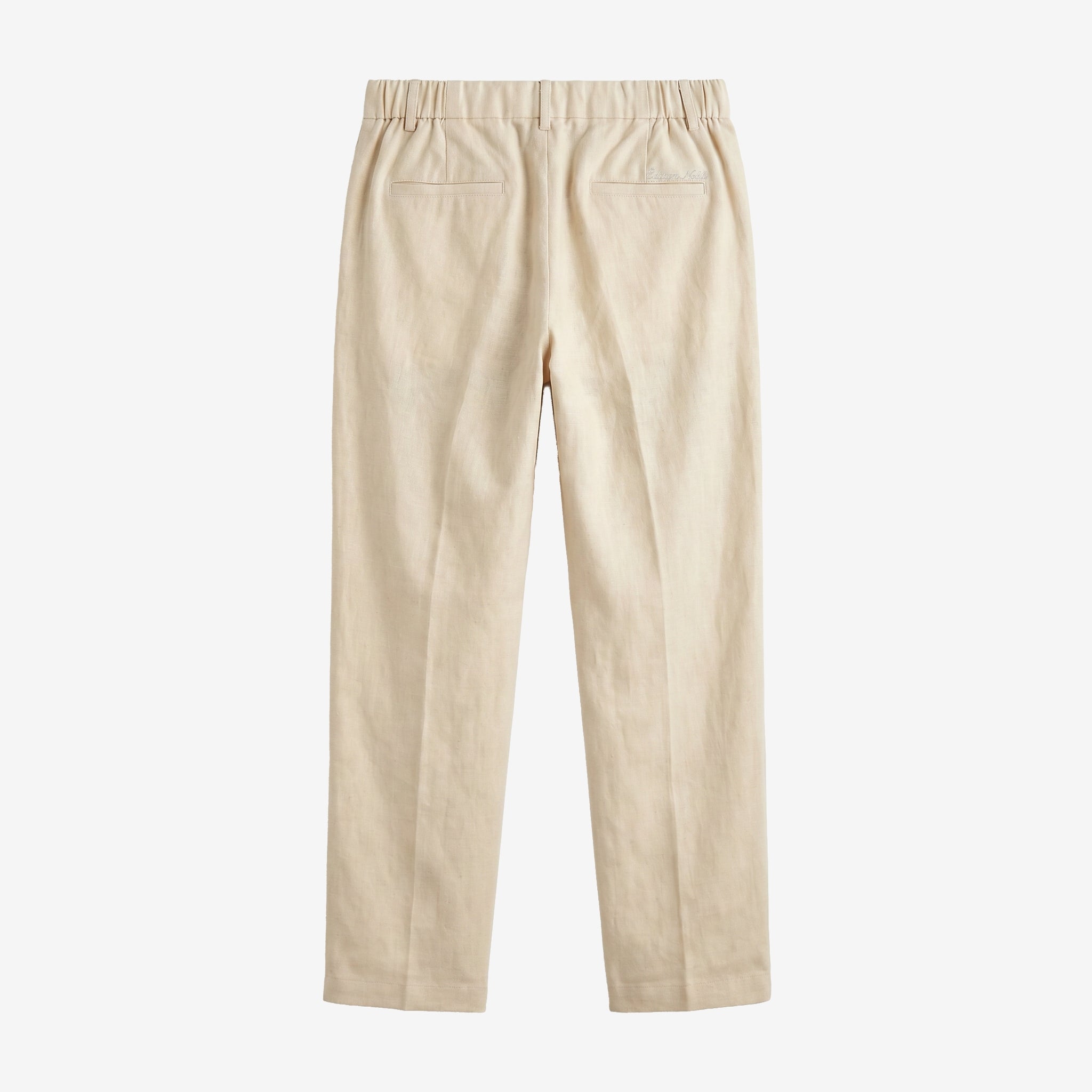 A pair of beige trousers shown from the back, featuring an elastic waistband and two welt pockets, set against a plain light gray background.